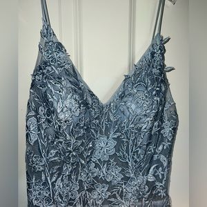 Prom dress size 4. Has a slit for your leg. Very pretty!